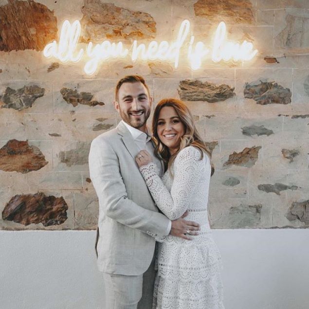 All You Need is Love LED neon wedding sign shown at an engagement party - from Custom Neon