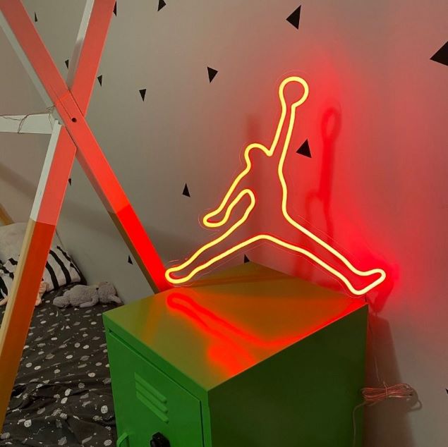 Basketball Legend Neon Art shown as children's room decor while illuminated - photo Custom Neon®