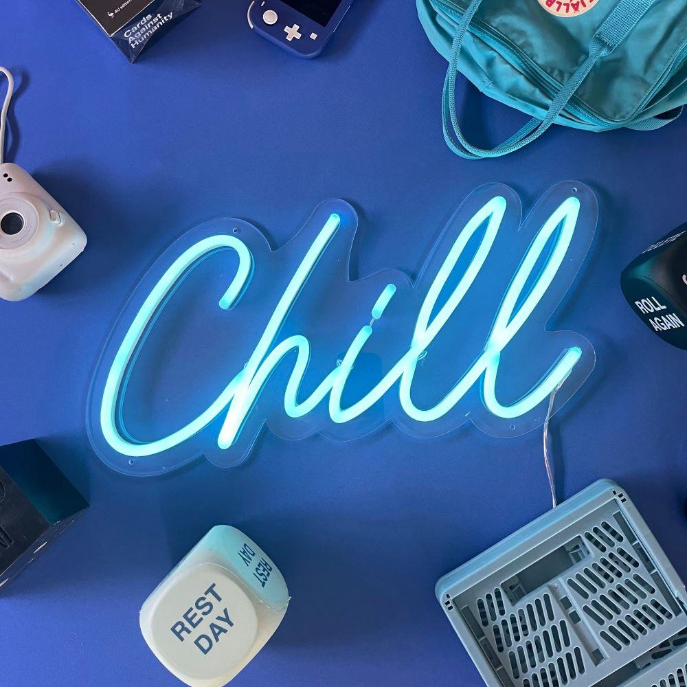 Custom Neon® light blue Chill sign shown illuminated against a dark blue background