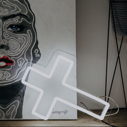 LED neon cross shown as home decor in white - photo from CustomNeon.com
