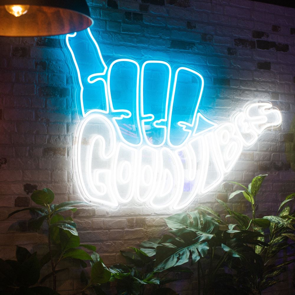 Good Vibes Hang Ten Custom Neon sign on brick wall @marketplacevauxhall in London UK