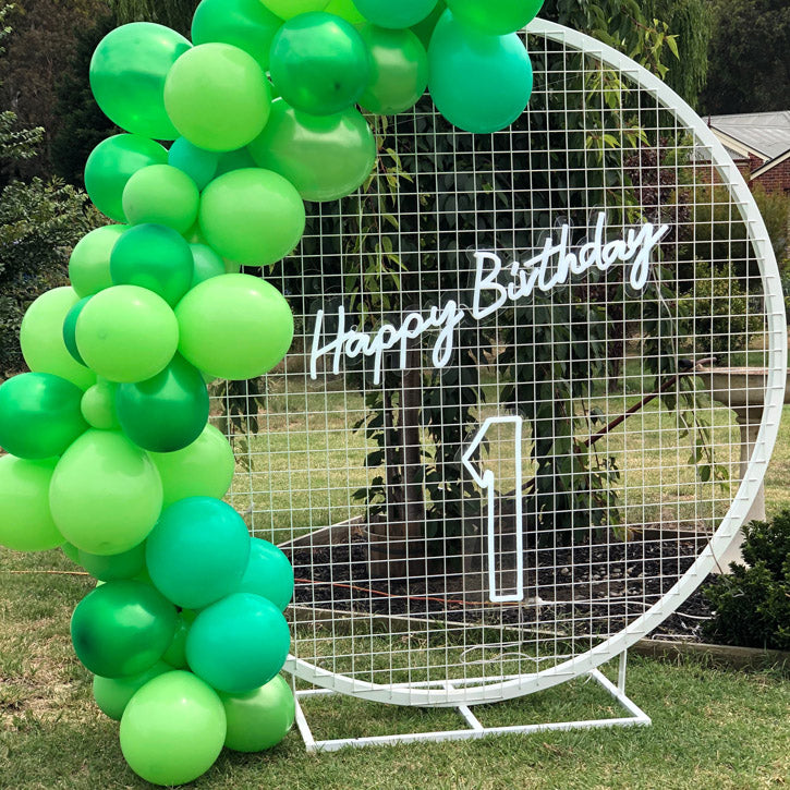 shown on brick wall with party decorations.