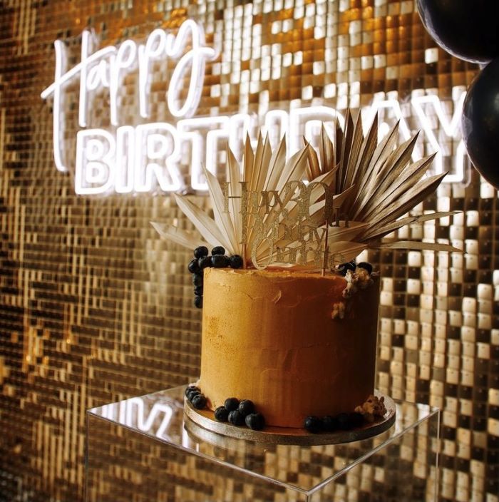 Happy Birthday is a double line LED neon word sign in two fonts on clear acrylic backboard that is cut around the shape.