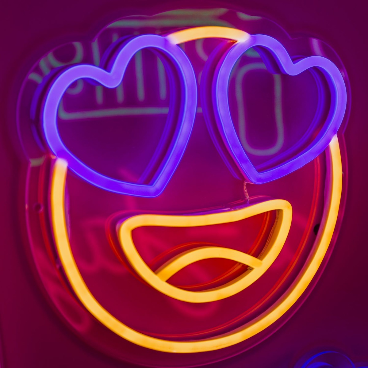 Custom Neon® Heart Eyes Emoji Sign shown in warm white and dark blue