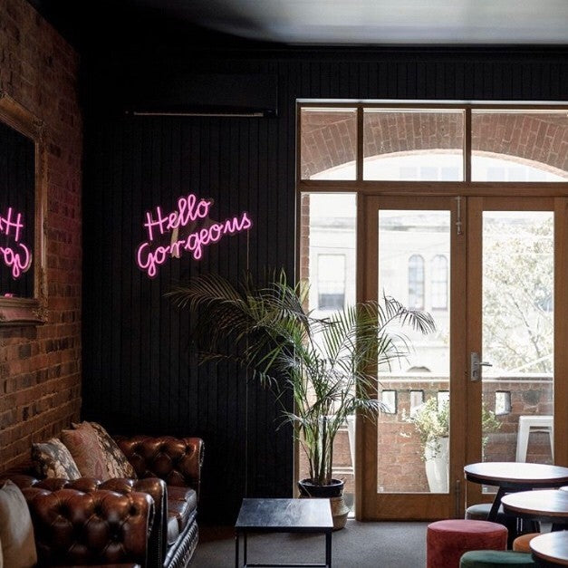 Hello Gorgeous LED neon sign in pink as seen in the cafe @playatrecess - from Custom Neon