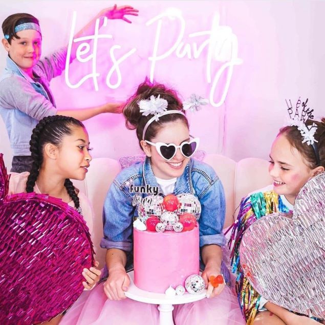 Let's Party LED neon sign shown at a tweens birthday party - from Custom Neon