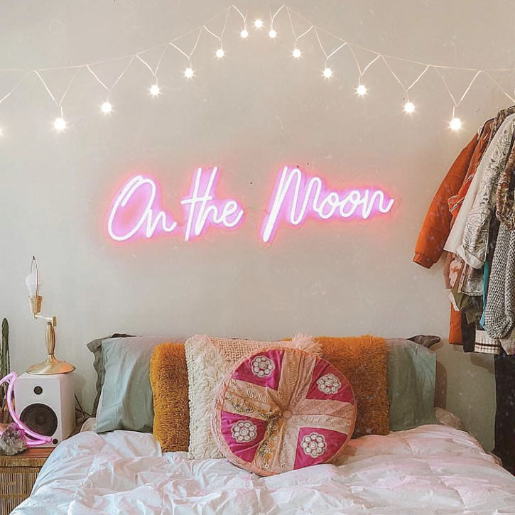 On the Moon bedroom neon sign shown above a bed - made by @customneon for @malloryonthemoon