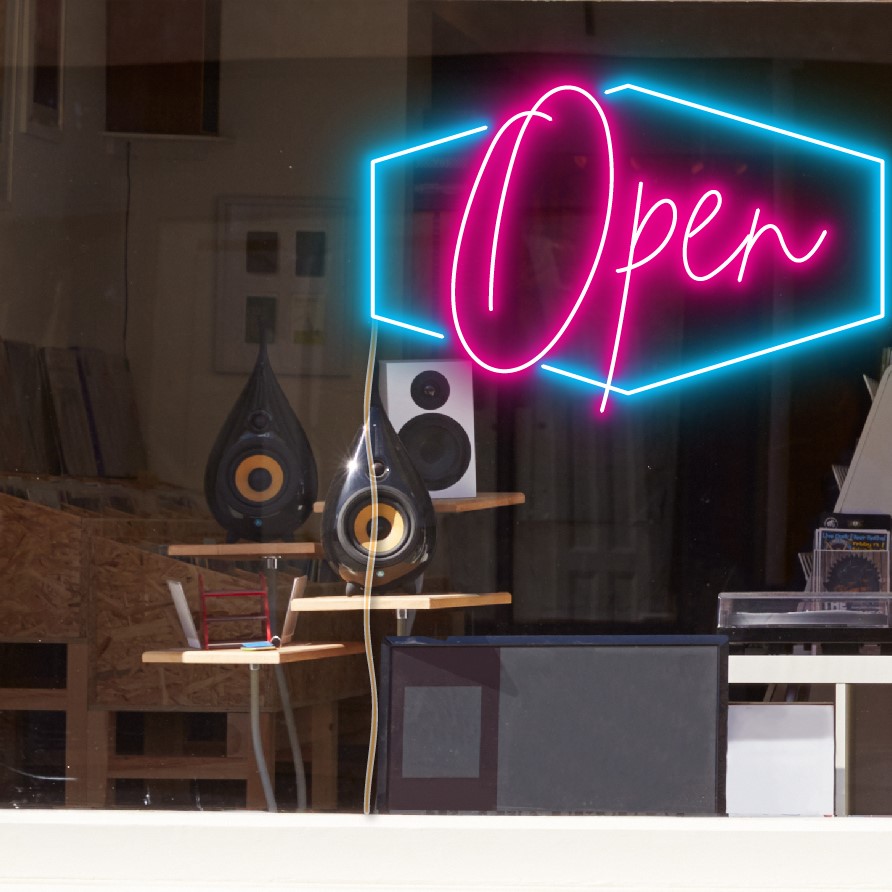 LED neon flex open sign shown in bright pink and blue with the WildSpirit font - from CustomNeon.com