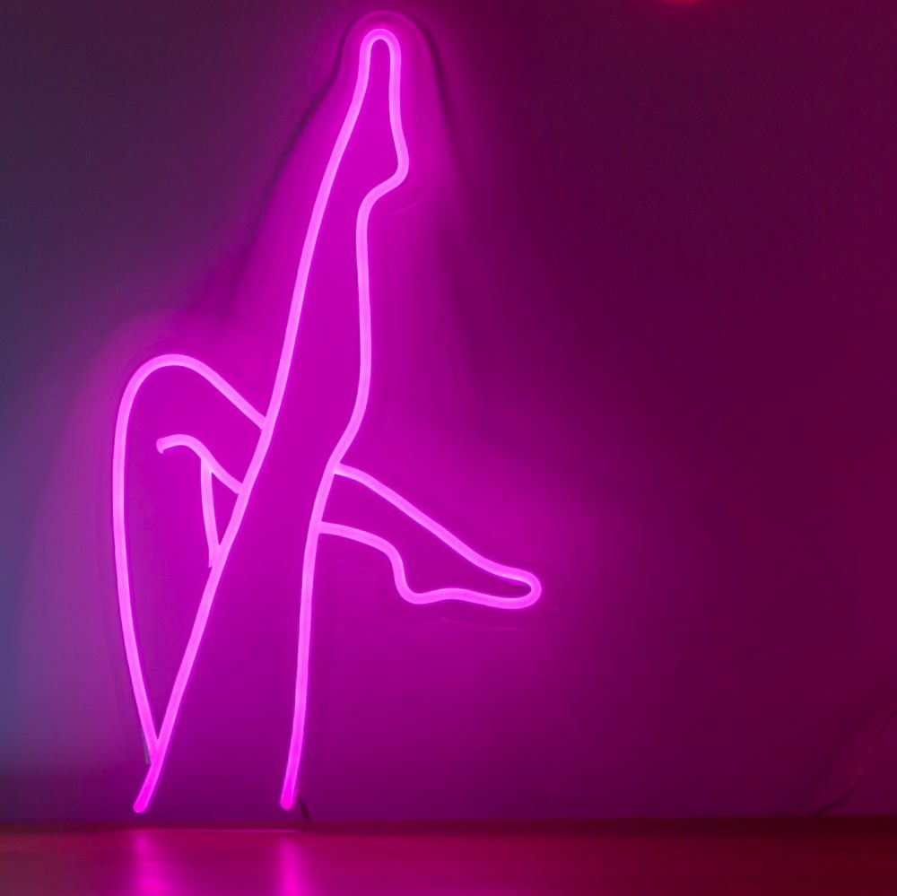 Sexy Legs LED neon sign above a bed - from Custom Neon®
