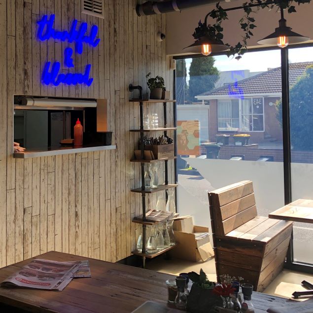 Thankful & Blessed LED neon sign shown @9gramscafe mounted above the serving counter - made by @customneon