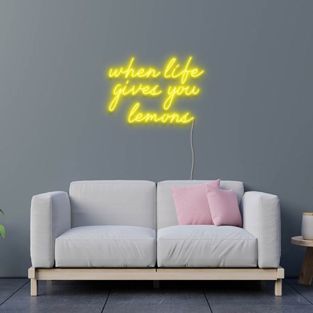 When Life Gives You Lemons yellow neon flex sign wall mounted above a sofa - design by Custom Neon
