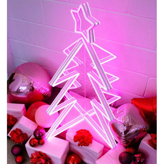3D Neon Christmas Tree shown with presents and a Santa Baby neon sign - by Custom Neon®