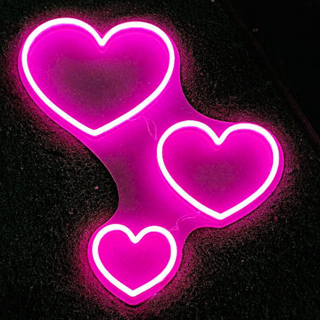 Three Hearts Light Up Wall Art shown illuminated - photo from CustomNeon.com