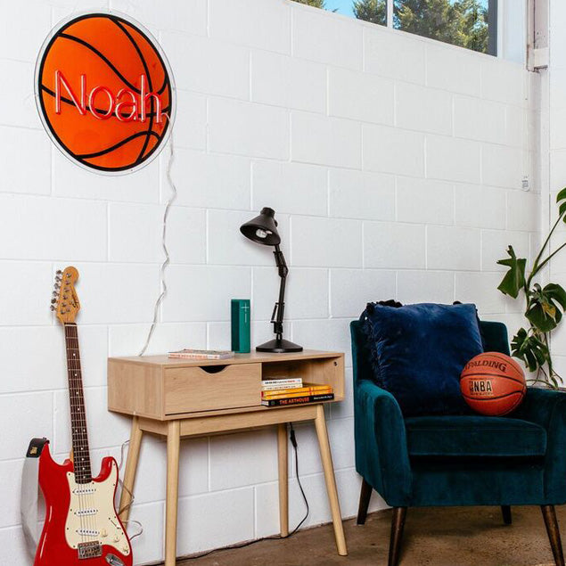 Basketball Name Sign in LED neon flex shown on a white brick wall - from CustomNeon.com
