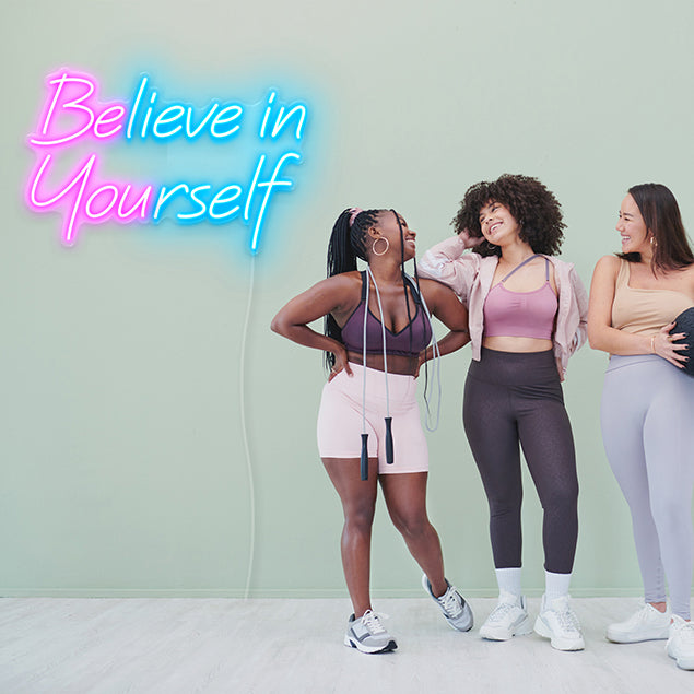 Be You / Believe in Yourself  CUSTOM NEON® sign in pink & blue on moss green fitness studio wall