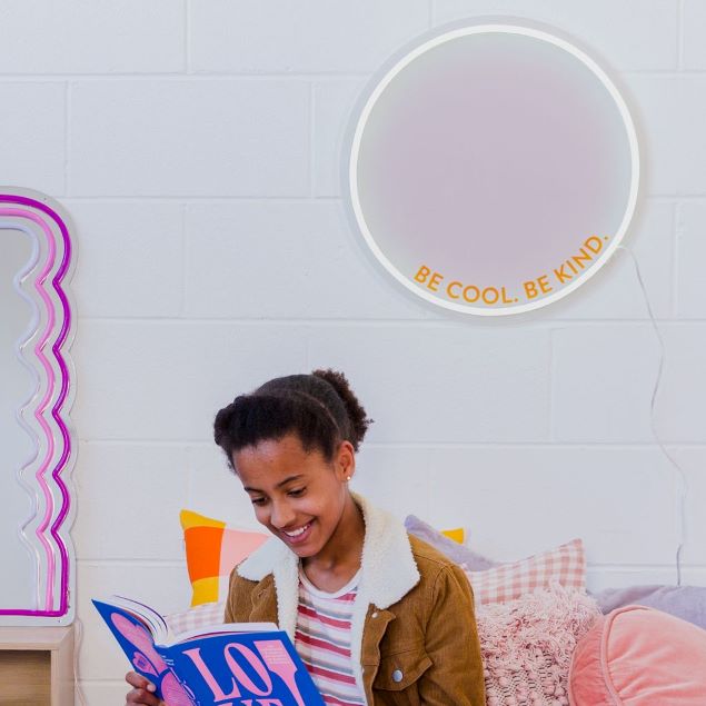  wall mounted above a sofa @customneon Signs of Change charity range