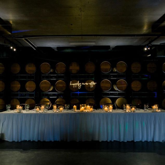 Custom Neon's Happily Ever After warm white light sign on wine barrels @SandlefordWinery photo by @louisefowlertuttphotography