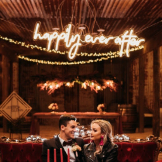 Happily ever after LED neon light shown hanging from the ceiling at a wedding party
- photo from CustomNeon.com