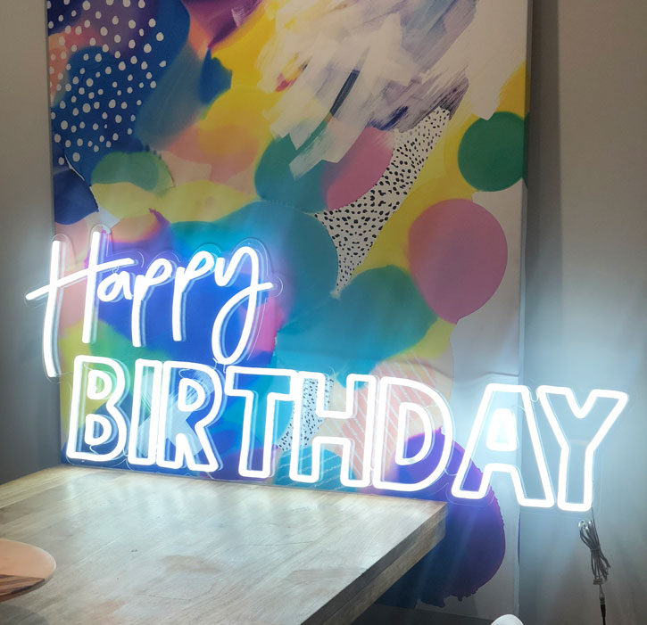 Custom Neon® Happy Birthday sign in white LED neon flex.
