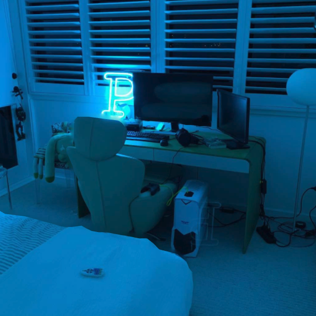 The Letter P in bright LED Neon shown in a bedroom - from Custom Neon™