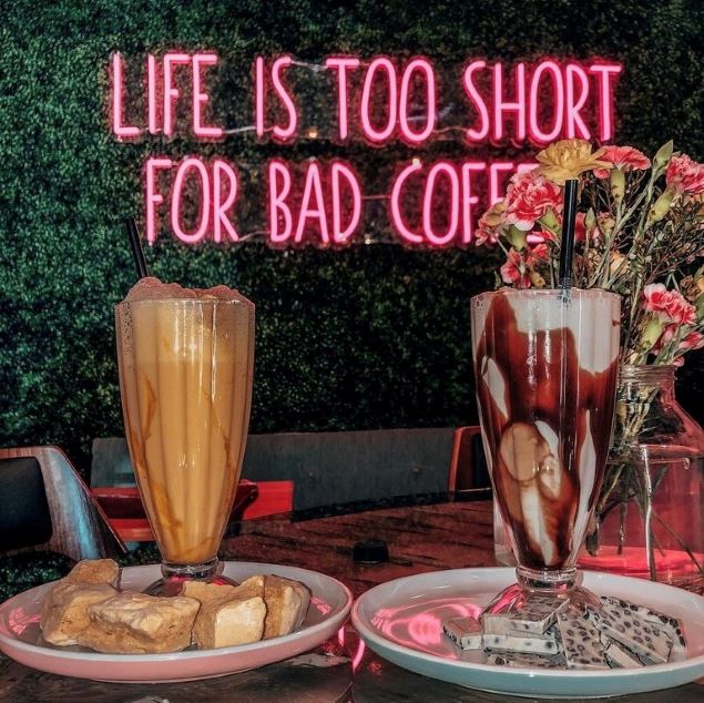 Life Is Too Short For Bad Coffee pink CUSTOM NEON® sign behind milk shakes @7beanscoffee