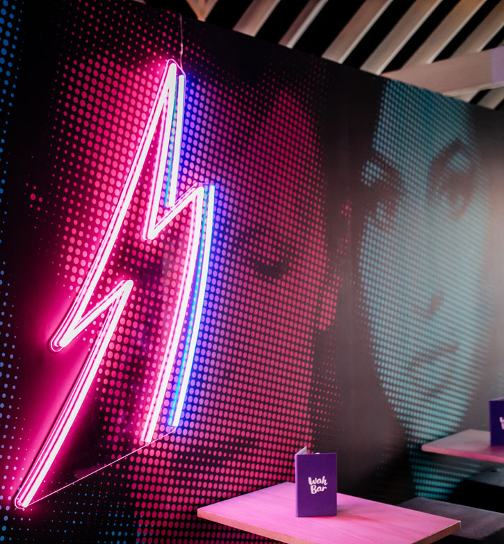 Lightning Bolt Neon Wall Art shown here on wall of a restaurant
