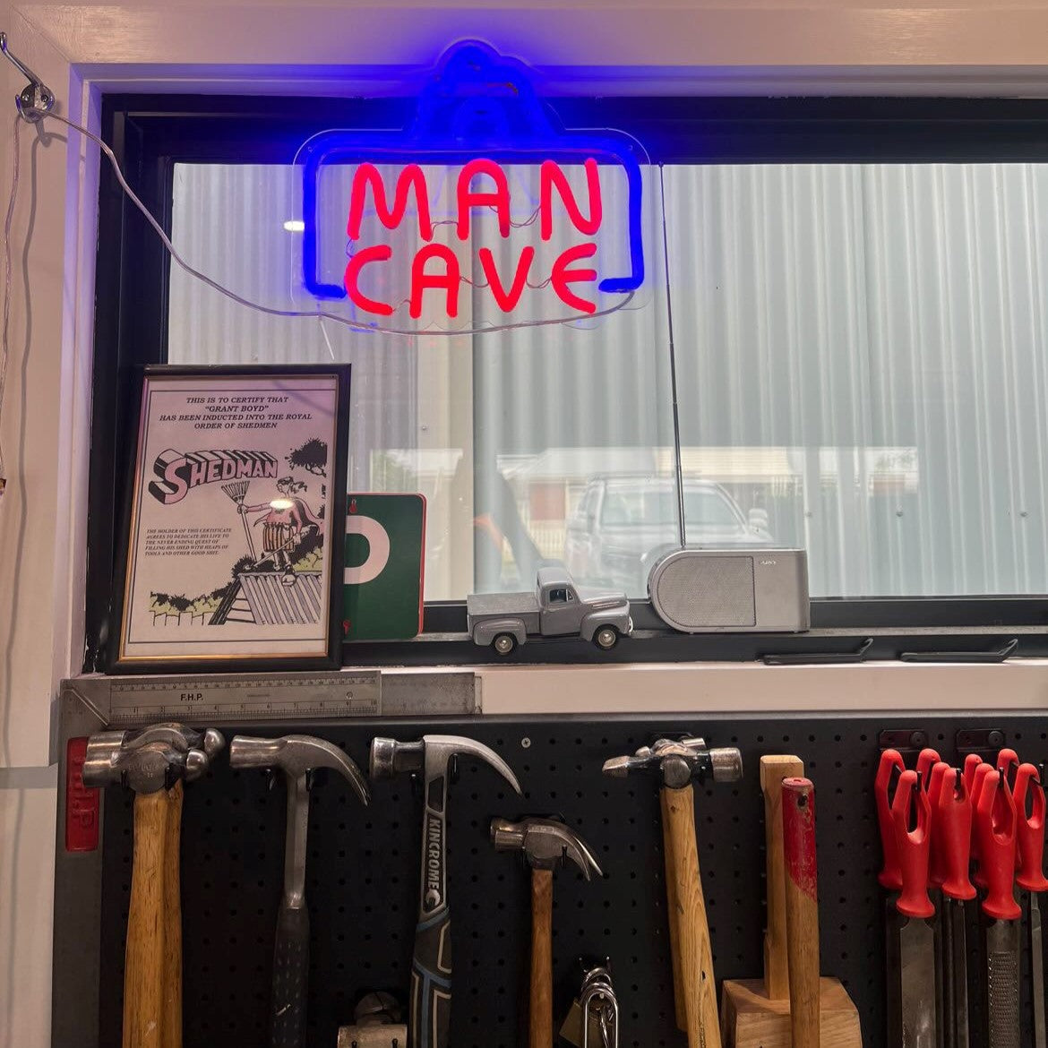 CUSTOM NEON® Man Cave sign in a customer's tool shed