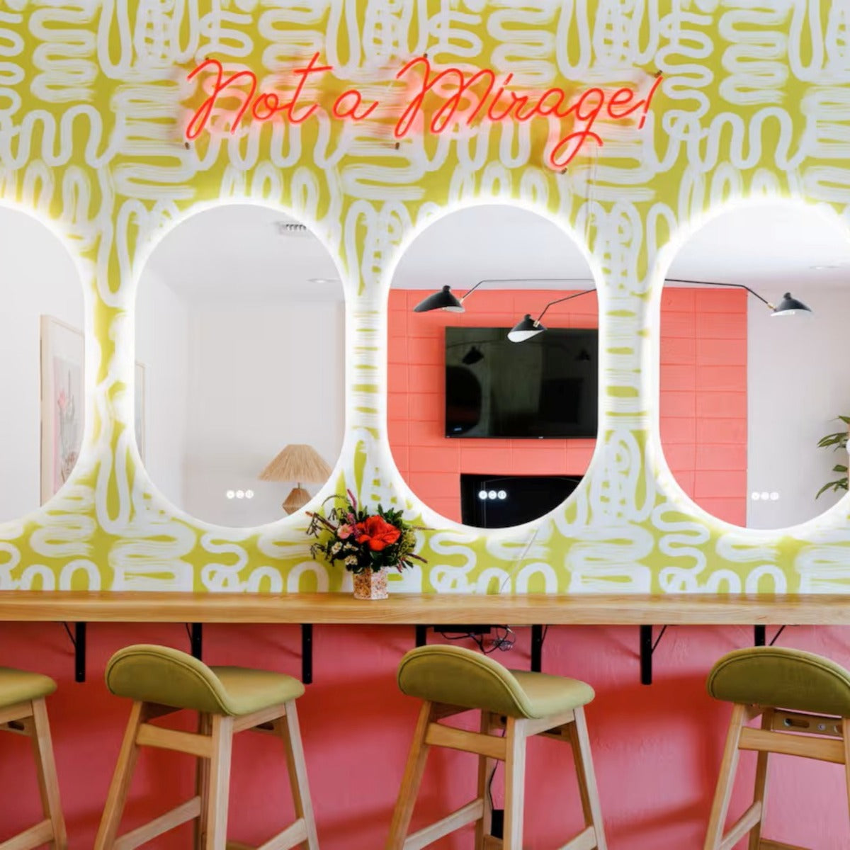 Not a Mirage! light red LED neon sign on a painted wall above mirrors - CUSTOM NEON™ x SOMERLED COLLECTION