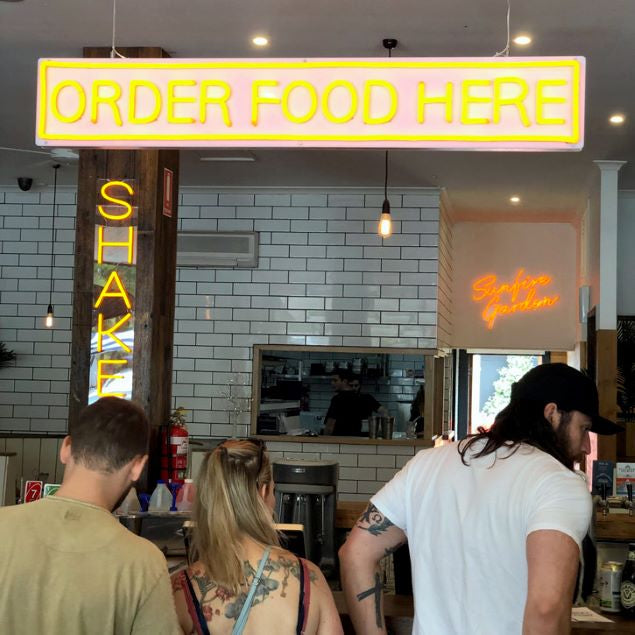 Order Food Here LED neon flex sign at a fast food restaurant - from Custom Neon®