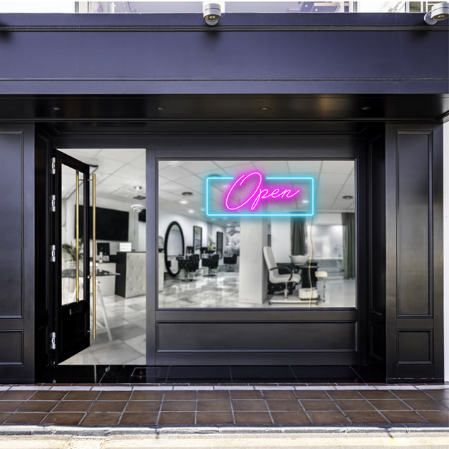 Pink open sign with a blue rectangular shown lit up on the window of a beauty salon - photo CustomNeon.com