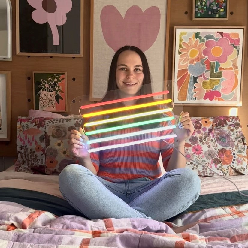 LED neon rainbow flag by Custom Neon®,Custom Neon® signs and artwork mounted above a bed,LED neon bedroom signs by Custom Neon®