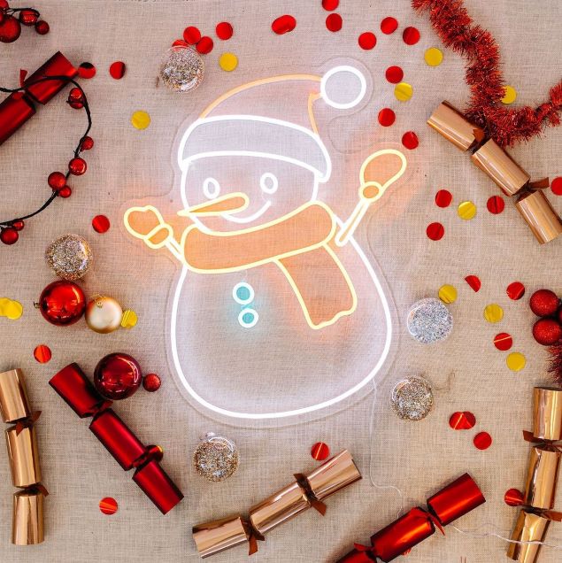 Custom Neon® snowman in bright white and warm white LED neon flex shown illuminated against a light background in bright light