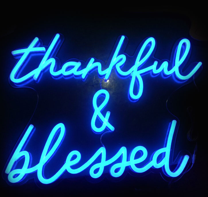 Thankful & Blessed LED Neon Sign in blue shown close up and illuminated - photo from Custom Neon
