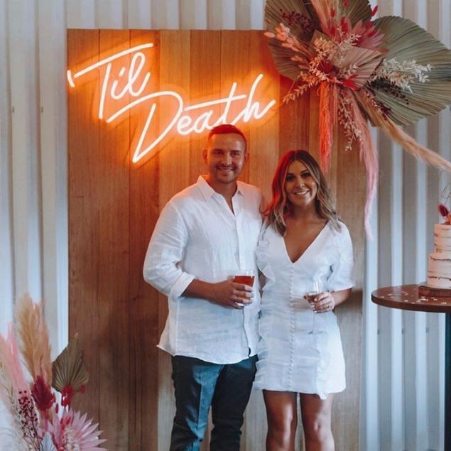 Til Death white neon flex sign as a focal point during a wedding ceremony - from Custom Neon