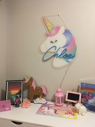 Unicorn neon name sign in blue turned on - from Custom Neon