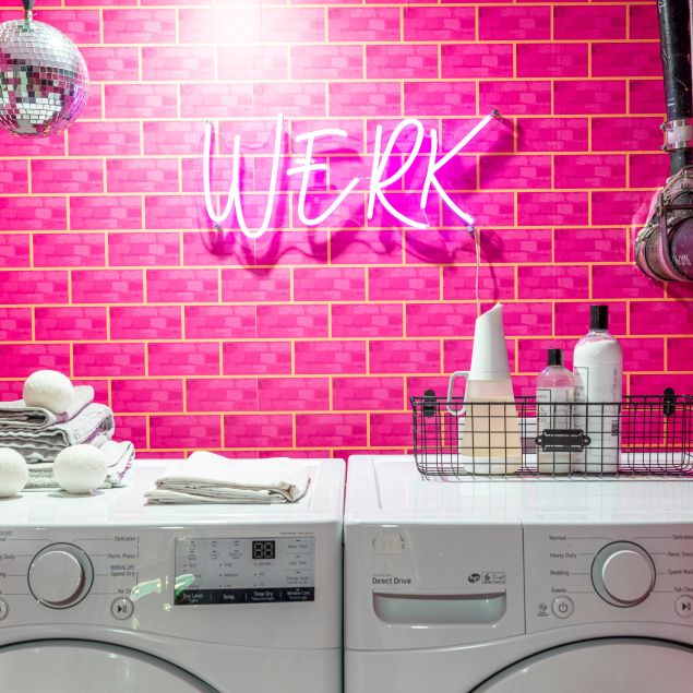 WERK pink light sign by CUSTOM NEON® shown on pink tiled laundry room wall @brownstoneboys