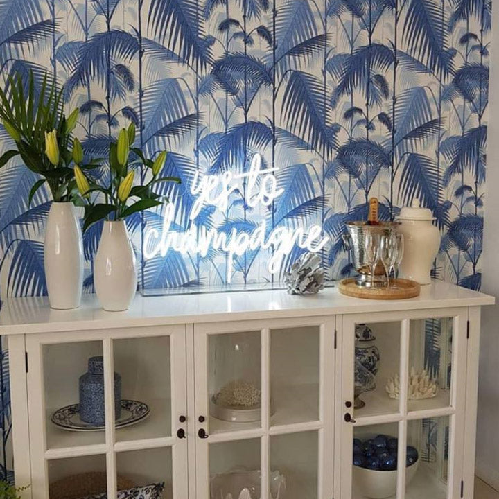 Yes to Champagne Neon Sign shown atop a sideboard - photo from CustomNeon.com
